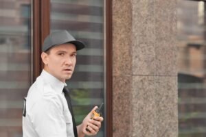 male-security-guard-with-portable-radio-outdoors_392895-175019